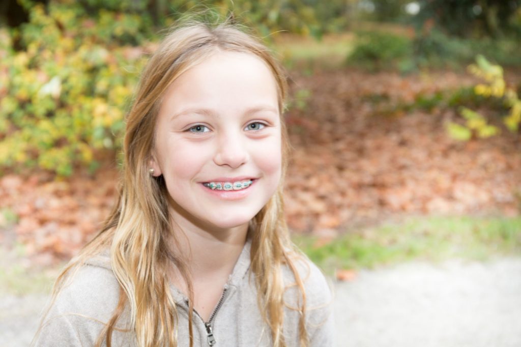 Smiling patient with braces in Mooresville